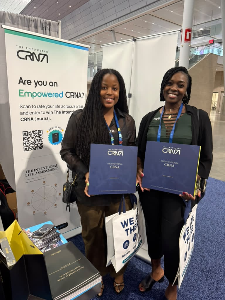 CRNAs with their copies of The Intentional CRNA at the Empowered CRNA booth