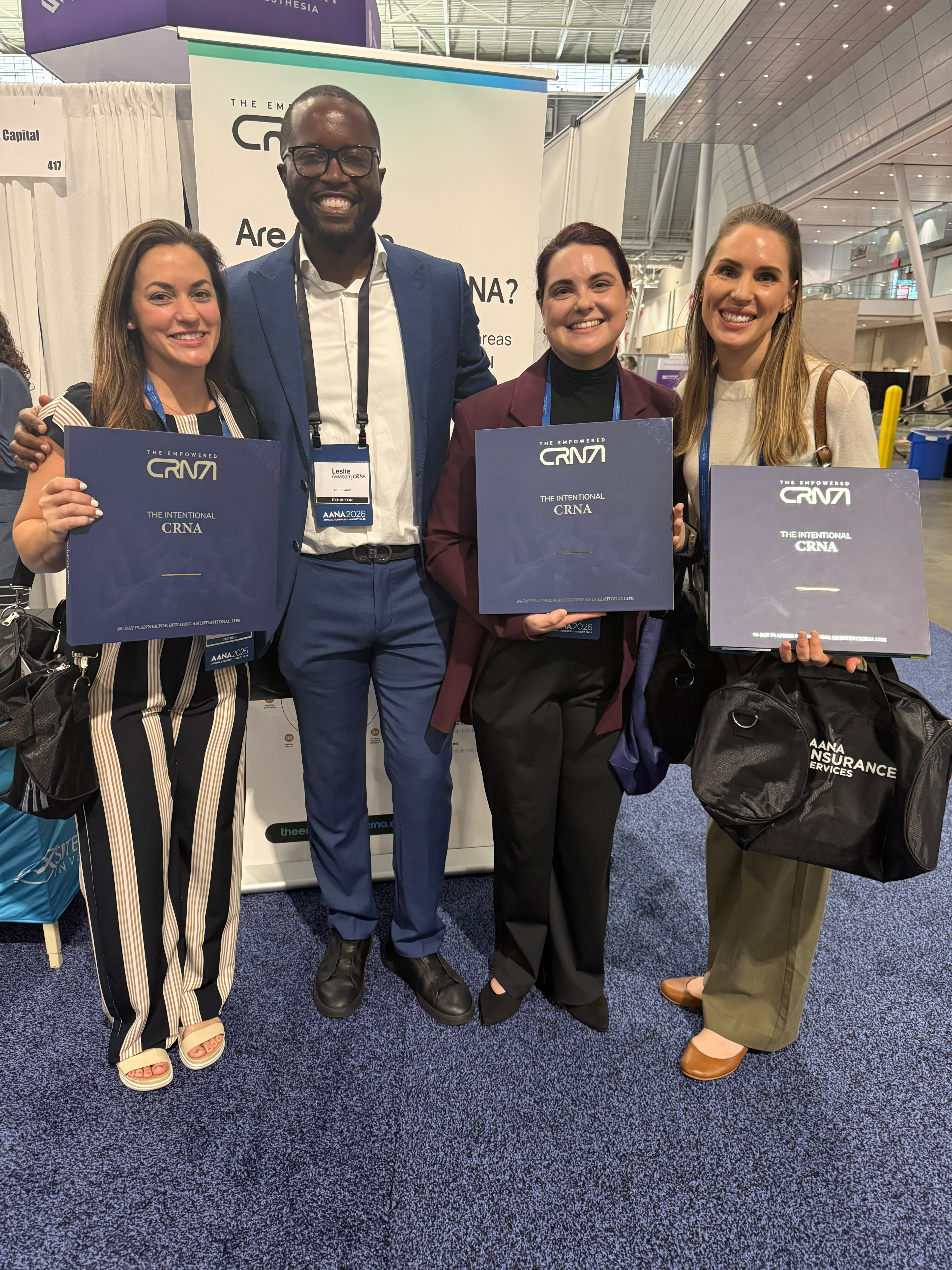 Leslie Awasom with three CRNAs holding The Intentional CRNA journals