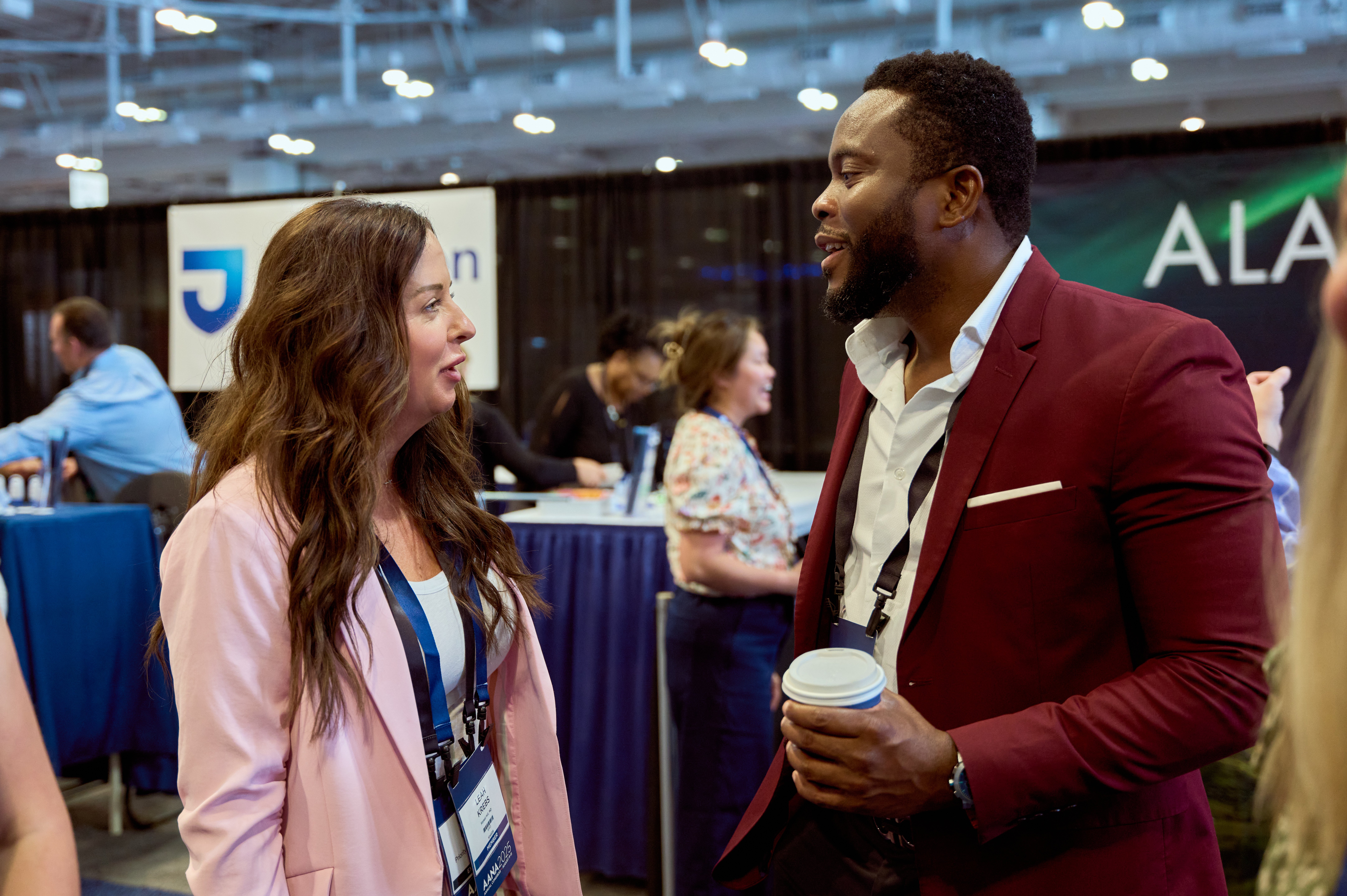 Community members in conversation at a conference